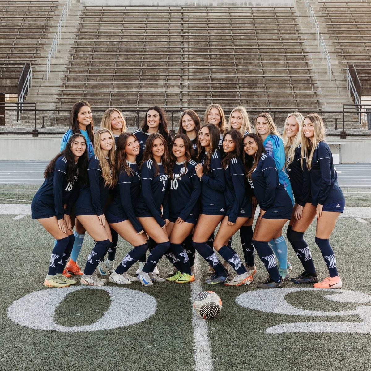 Newport Harbor girls soccer players on the field.