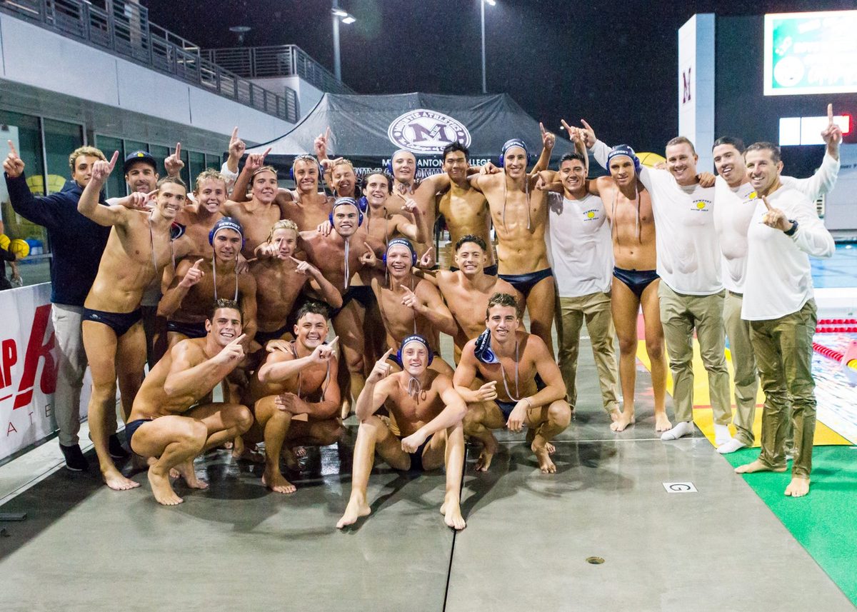 Newport Harbor boys water polo team posing poolside.