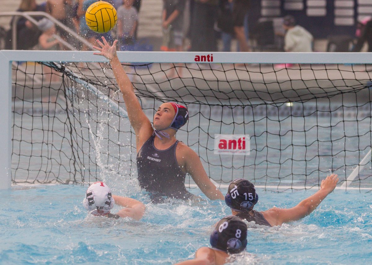 Newport Harbor goalkeeper reaching for a shot.